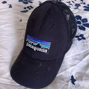 Black Patagonia trucker hat, broken in and slightly worn